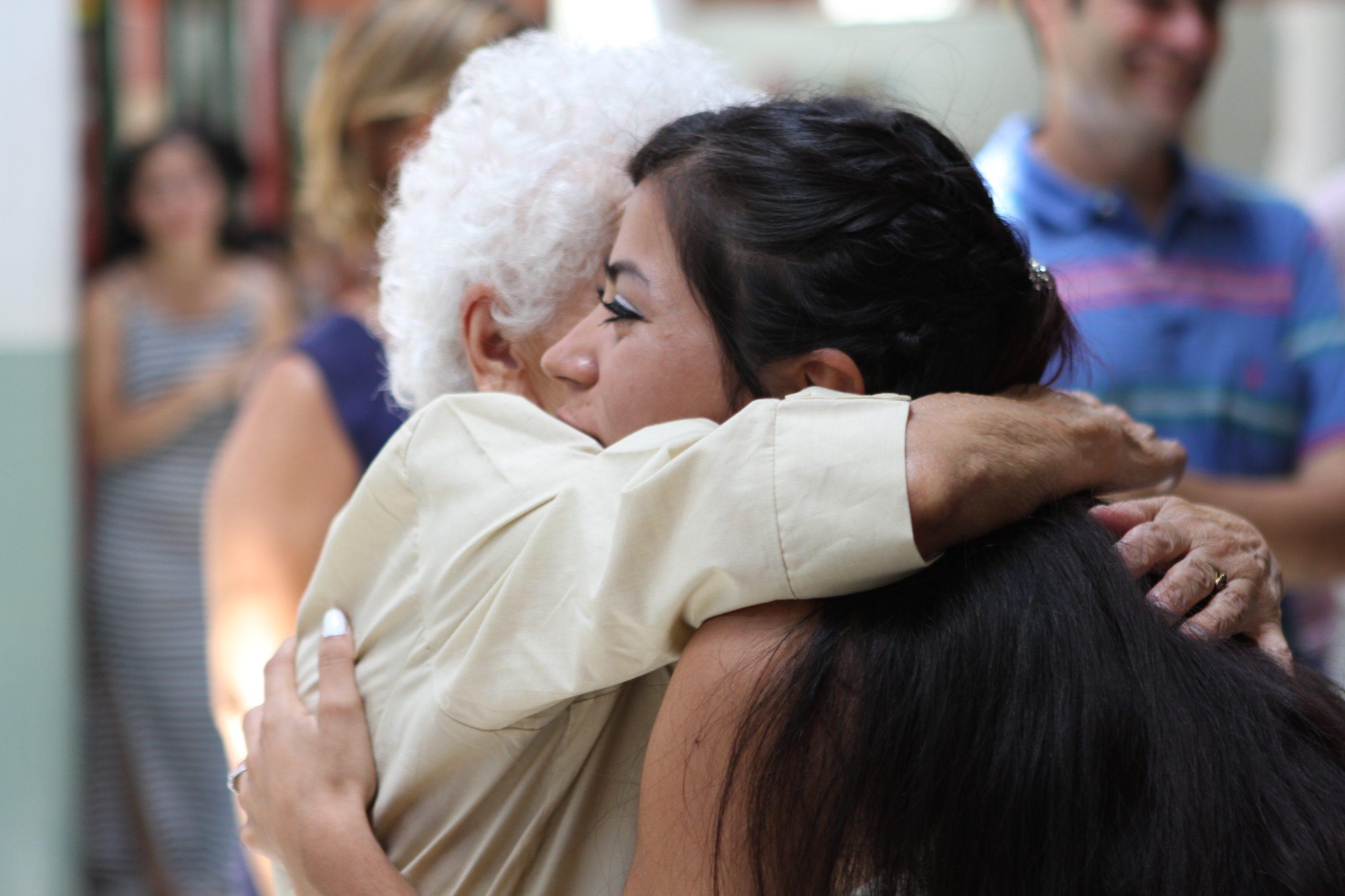 Old and young women embracing