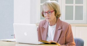 older woman concerned with computer phishing scams