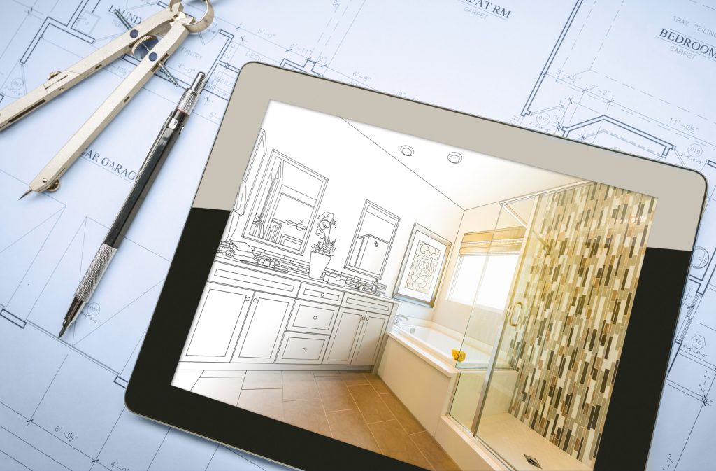 blueprint with drafting tools and ipad showing transformation of bathroom remodel